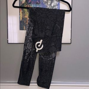 Peloton logo NUX brand grey floral leggings